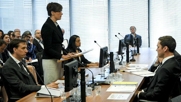 Rowena Orr flanked by Mark Costello and Eloise Dais at the royal commission this week. 