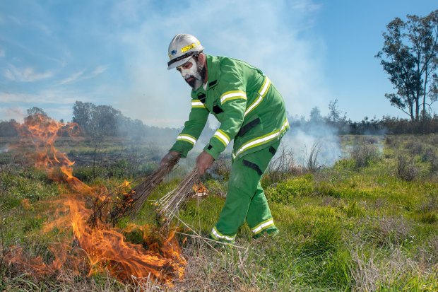 Mick Bourke lights a fire using traditional methods in Boort, Victoria in September 2019.