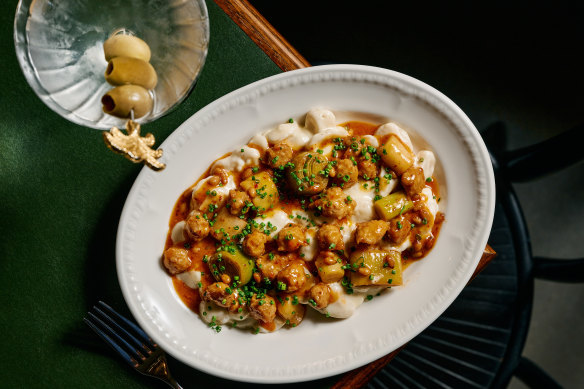 Lebanese garlic dumplings with poached leeks, spiced chicken and pine nuts.