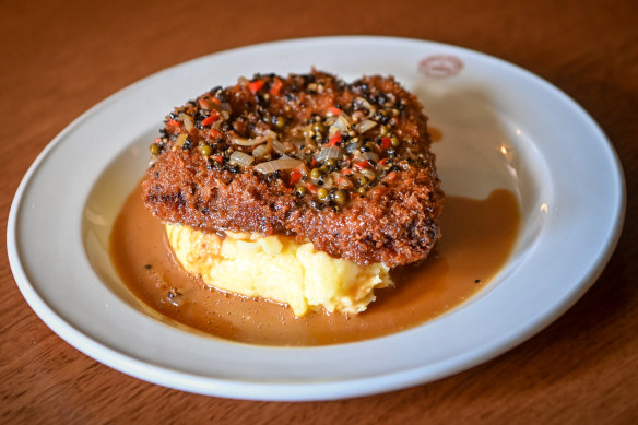 Kangaroo schnitzel with mash and pepper sauce at Punters Club.