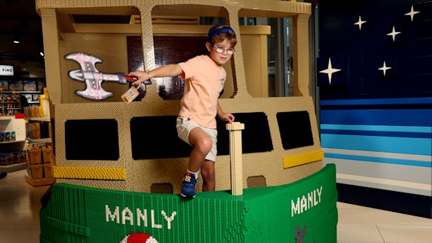 Leo Fenton-Wells commanding rough seas with a golden hammer in the Lego store on Pitt Street Mall.