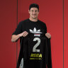 Jake Carlisle, Aaron Hamill and Tony Brown with their No. 2 jumpers.