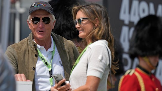 FILE - LIV Golf CEO Greg Norman stands on a tee box with his wife Kirsten Kutner during the final round of the inaugural LIV Golf Invitational at the Centurion Club in St. Albans, England, Saturday, June 11, 2022. Norman and his wife are being sued by a high school girl who says she was sexually assaulted at their Florida home in Sept. 2021, by two boys during a party where alcohol was served to her, her alleged attackers and other minors. (AP Photo/Alastair Grant, File)