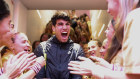 Spain’s Carlos Alcaraz is greeted by the ball kids on the stairs to the locker room after victory at the French Open. 