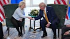 Ursula von der Leyen shakes hands with Donald Trump during a meeting at Trump Turnberry golf club in Scotland. 