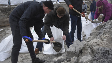 Volunteers fill sandbags to build barricades in Odesa, Ukraine.