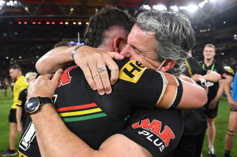 Nathan Cleary of the Panthers hugs his father and coach Ivan Cleary after winning the 2021 NRL premiership.