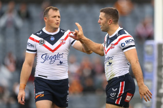 Josh Morris and James Tedesco celebrate during the Roosters’ latest rout.