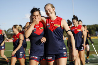 The Demons celebrate. 