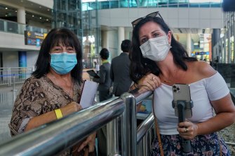 Josie Barron, left, is welcomed at the airport in Denpasar by her daughter Karlie Cummins.