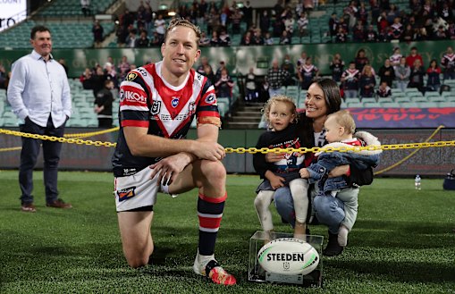 Mitchell Aubusson of the Roosters poses with his wife Laura and children after playing his 303rd match for the Roosters against the Sharks, making him the most-capped player in the club's history.
