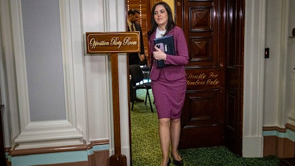 Moira Deeming leaves a Liberal Party meeting.