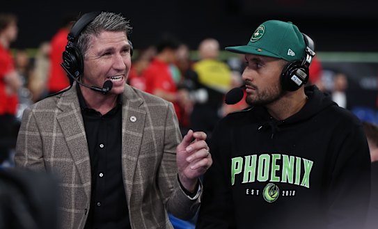 Nick Kyrgios (right, pictured with Australian former NBL player Damian Martin) joined the ownership group of the Phoenix in 2023.