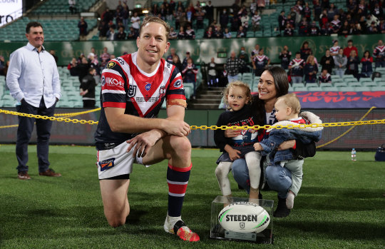 Mitchell Aubusson of the Roosters poses with his wife Laura and children after playing his 303rd match for the Roosters against the Sharks, making him the most-capped player in the club's history.