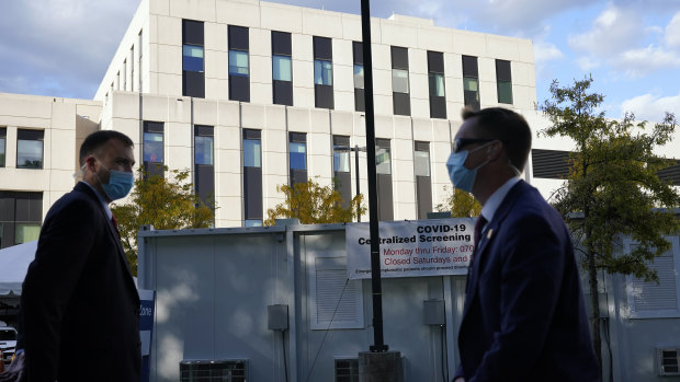 Members of the US Secret Service stand outside Walter Reed National Military Medical Centre, in Bethesda, Maryland.