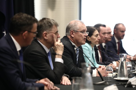 Prime Minister Scott Morrison addresses the media with premiers, chief ministers and Chief Medical Officer Brendan Murphy following a Council of Australian Governments meeting in Sydney.