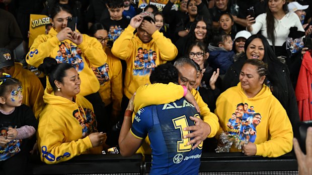 Eels junior Joash Papalii with his father, Pele, and mother, Margaret, after the match.