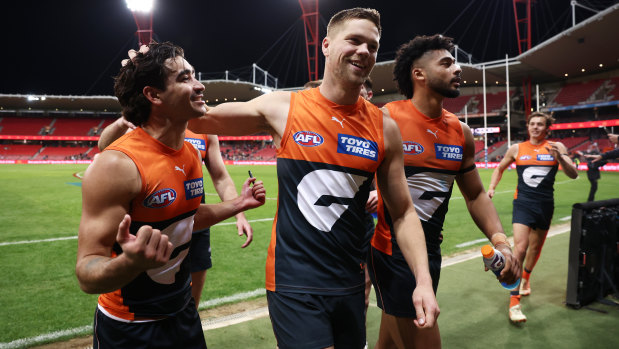 Toby Bedford and Harry Himmelberg celebrate the Giants’ win over Fremantle.