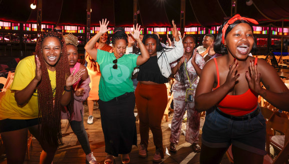 The choir perform an impromptu number during a sound check at the Spiegeltent Festival Garden. 