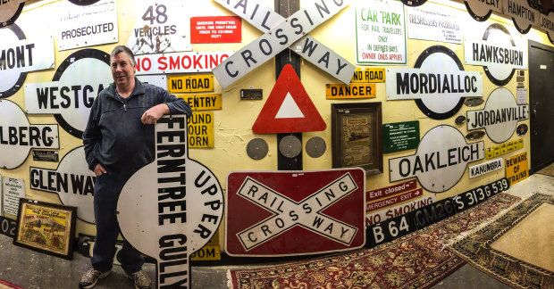 Signs, signs, everywhere a sign: Graham Dann with some of the railway signs he is selling on Sunday. 