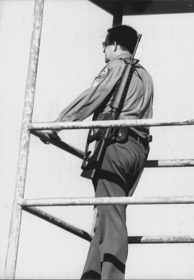 A policeman mans a watch tower at Long Bay on August 19, 1979. 