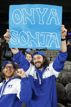 Kangaroos fans hold a sign in support of club president Sonja Hood.