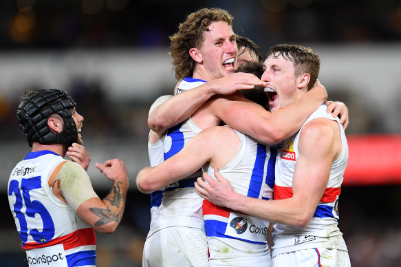 Western Bulldogs players celebrate after the thrilling win over the Lions.