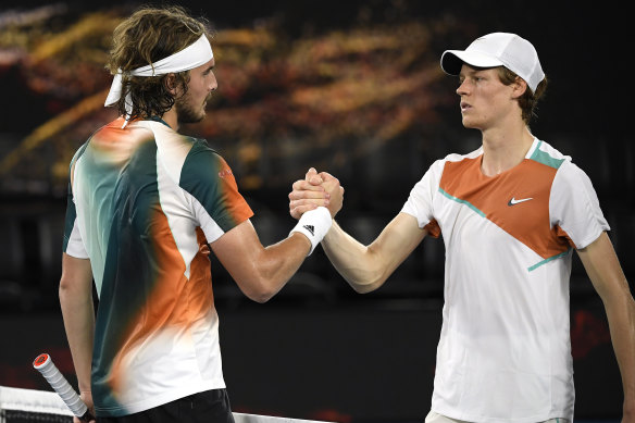 Stefanos Tsitsipas, left, is congratulated by Jannik Sinner.