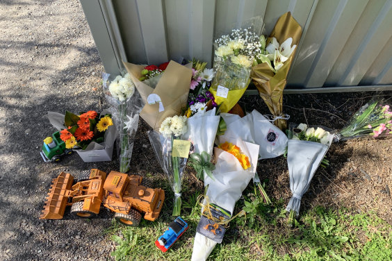 Flowers and toys placed outside the toddler's home.