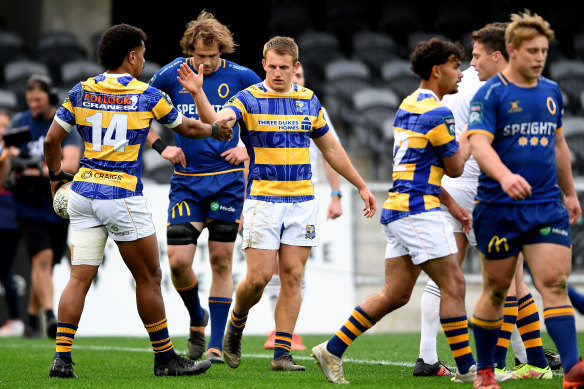 Joey Walton (centre) celebrates the try of Bay of Plenty teammate Emoni Narawa against Otago.