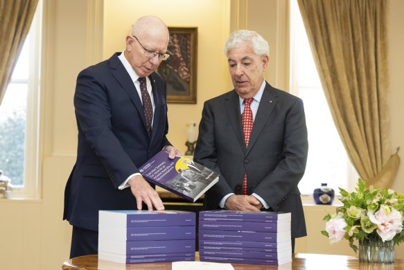 Governor-General David Hurley receives the final report by the Royal Commission into Violence, Abuse, Neglect and Exploitation of People with Disability, from Ronald Sackville, chair of the royal commission, at Government House. 