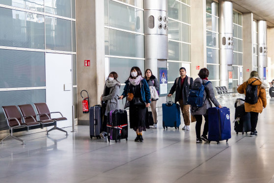 Travellers arriving at Charles de Gaulle Airport in Paris. The man who died in Paris from coronavirus on Friday was an elderly Chinese tourist.  