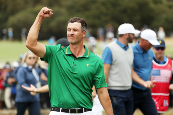 Adam Scott pumps up the crowd after he and Louis Oosthuizen defeated Dustin Johnson and Matt Kuchar.