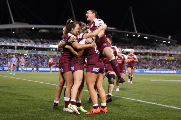 The Maroons celebrate.