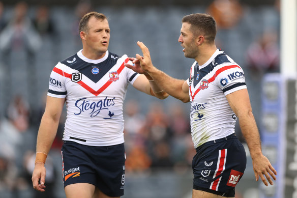 Josh Morris and James Tedesco celebrate during the Roosters’ latest rout.