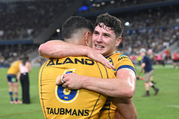Mitchell Moses embraces Dylan Brown.