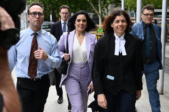 Moira Deeming (centre) after her court win on Thursday.