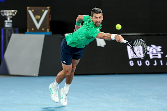 Novak Djokovic reaches for a shot.