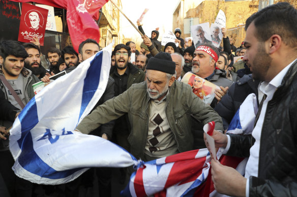 At protest outside the British embassy in Tehran, demonstrators burnt British and Israeli flags. 