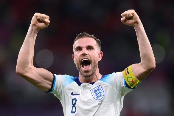 An ecstatic Jordan Henderson salutes the English fans.
