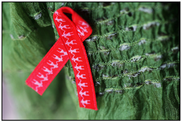 The red ribbon has been the symbol for AIDS-HIV support for decades.