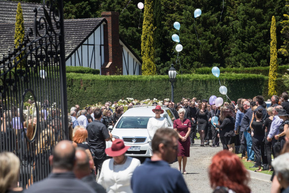 Balloons were released at the end of the service, which was held in the gardens of a reception center in Whittlesea.