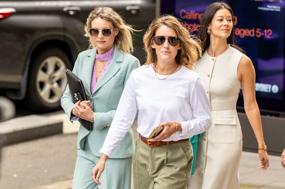 Sall Grover (centre) outside the Federal Court in Sydney on Friday.