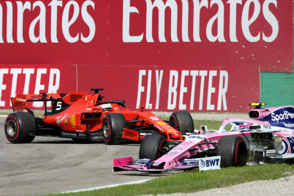 Lance Stroll's Mercedes is collected by the Ferrari of Sebastian Vettel.