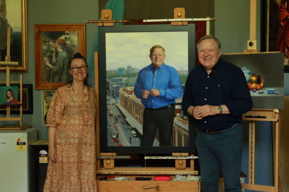 Artist Vicki Sullivan with Peter Hitchener, and her portrait 50 Years of Good Evening.