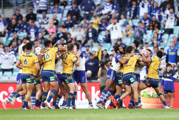 A scuffle breaks out between several players.
