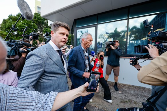 Sam Wood’s barrister Mathew Cuskelly and father Andrew Wood outside court in Maroochydore.
