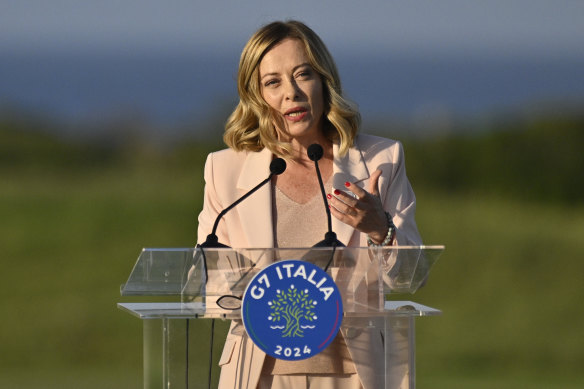 Italian Prime Minister Giorgia Meloni, gives a speech at San Domenico Golf Club during day one of the 50th G7 summit.