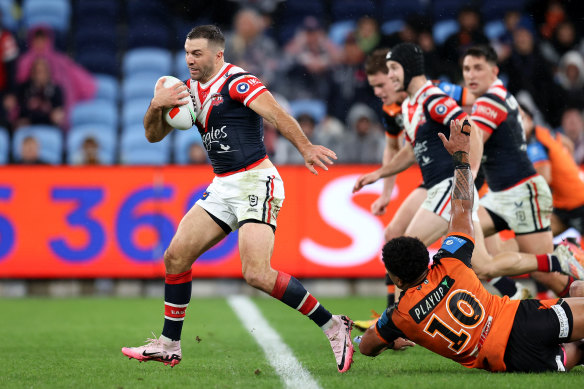 James Tedesco breaks clear against the Tigers.