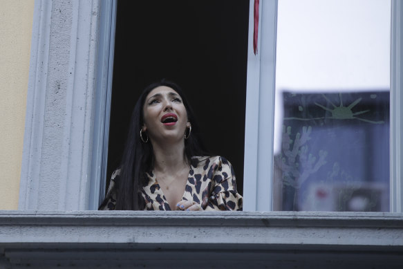 Italian opera singer Laura Baldassari sings from her apartment window.